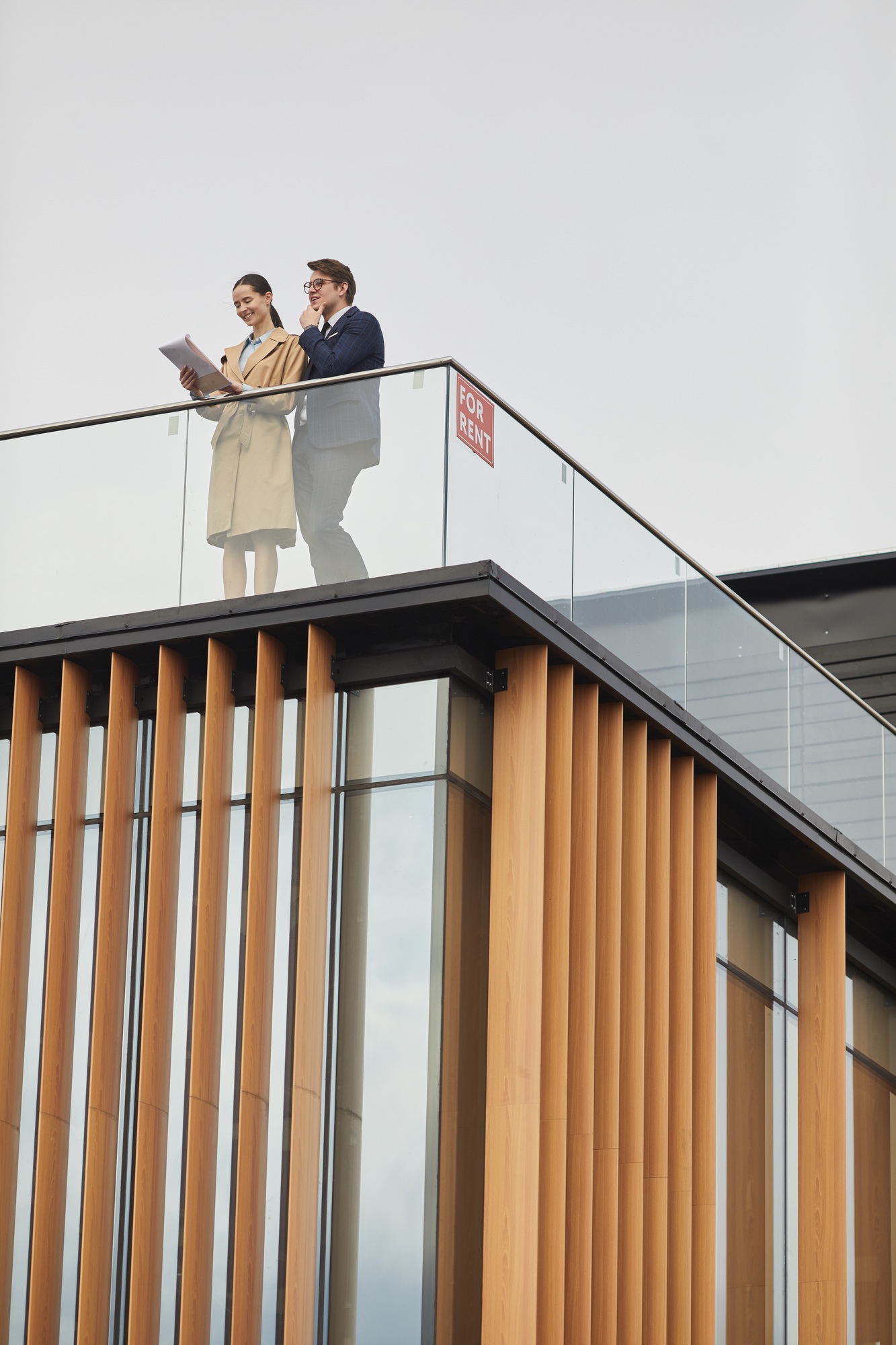Two Real Estate Agents Standing on Roof